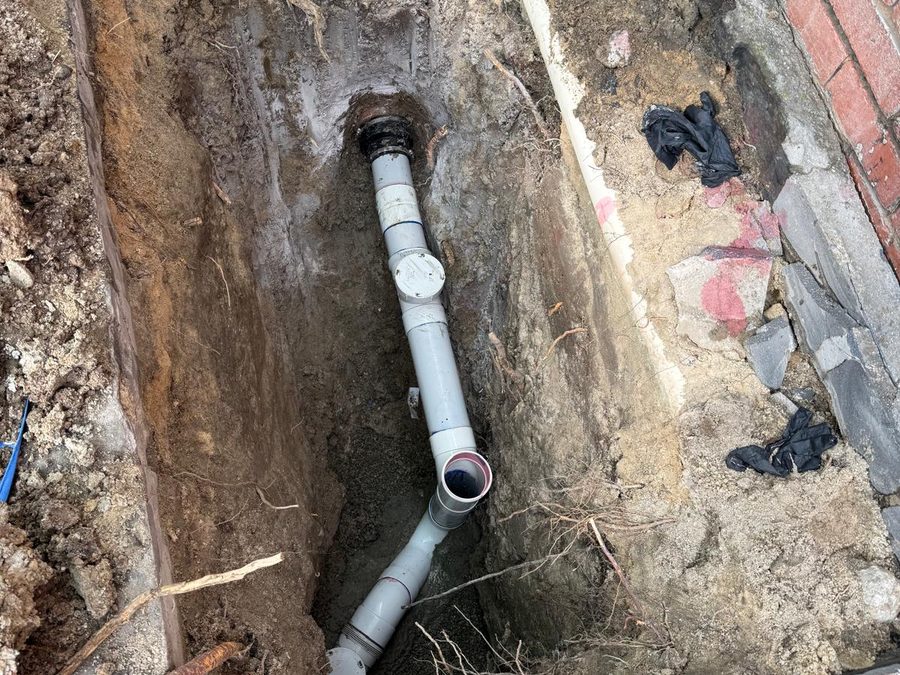 Excavated sewer pipe repair in progress at a Melbourne property