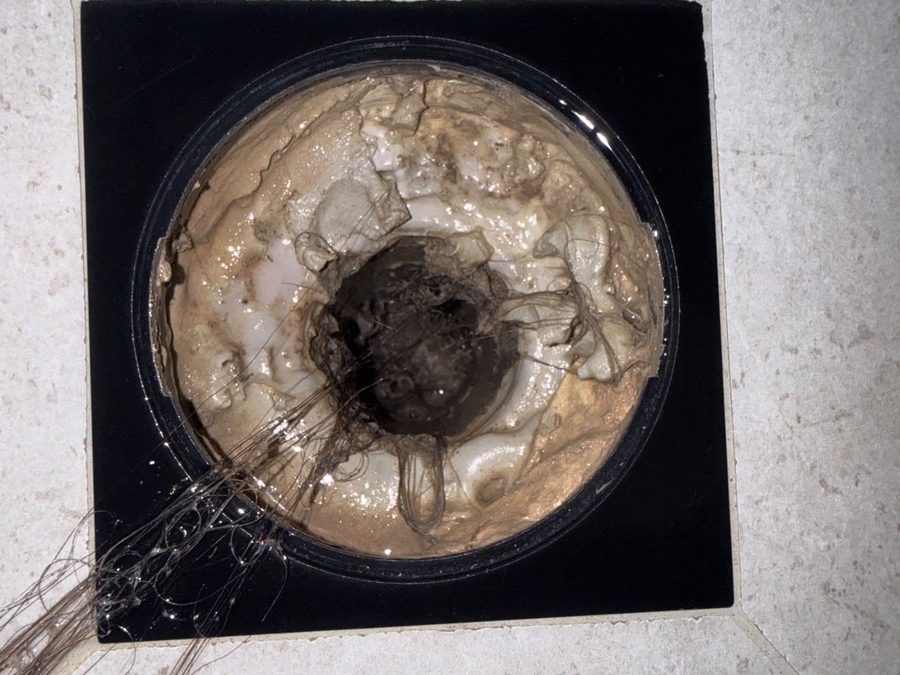 Blocked shower floor waste in a Melbourne bathroom