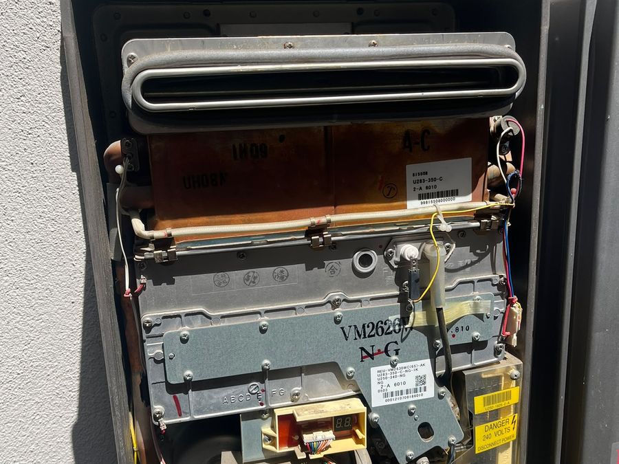 Hot water unit opened up for fault diagnosis on a Melbourne job