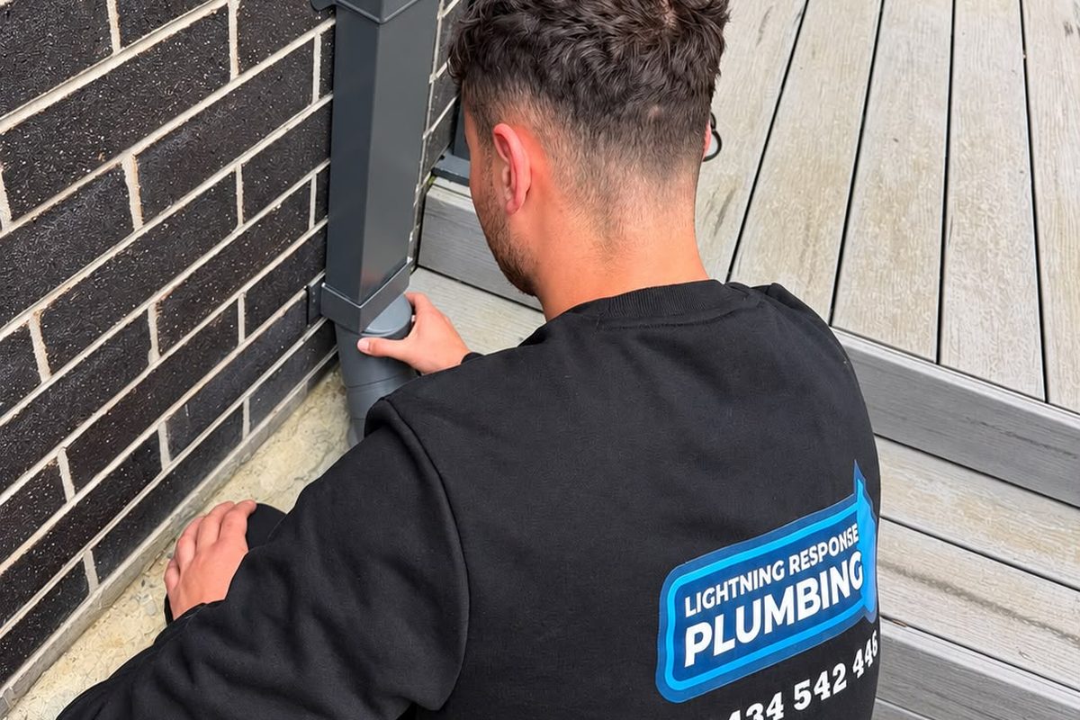 Lightning Response Plumbing plumber connecting a downpipe to the storm water drain at a Melbourne home